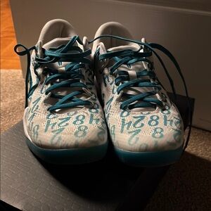 Teal and White Athletic Shoes